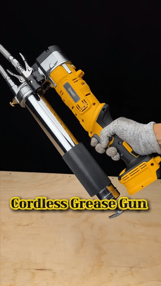 GreaseVolt cordless grease gun in hand, trigger doing the work